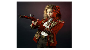 Women’s red military style leather jacket with gold embroidery and structured fit, stylish fashion model portrait
