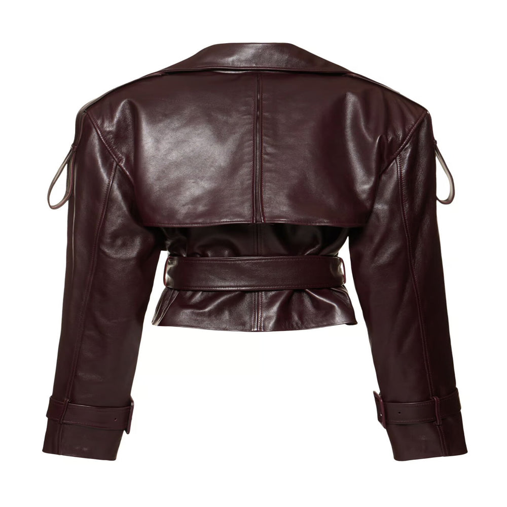 Women’s burgundy cropped leather jacket featuring belted moto design and trench-inspired look