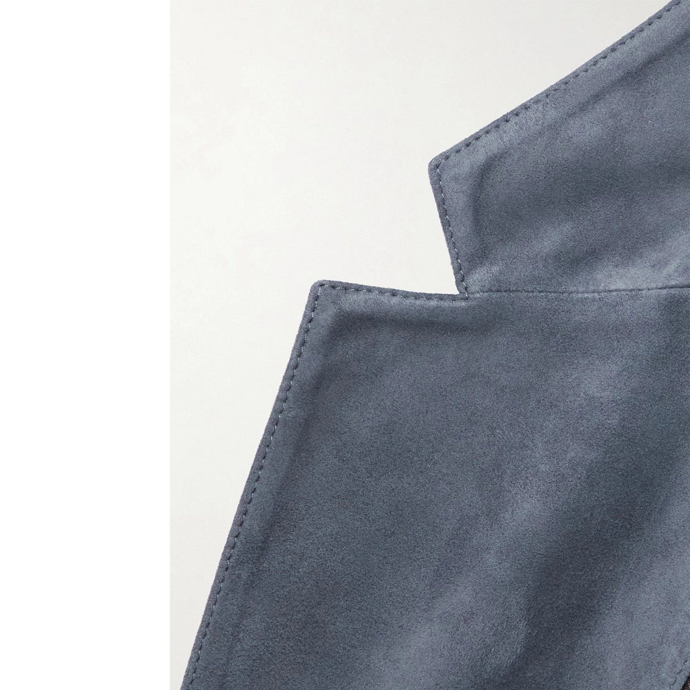 Sharp lapel detailing, premium suede finish, classic blazer design, refined and polished look, vintage-inspired menswear.