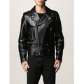 Men wearing vintage black real leather jacket – outdoor motorcycle fashion shot