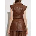 Back detail of women’s brown leather dress showing belt, vertical panel seams, and structured back yoke