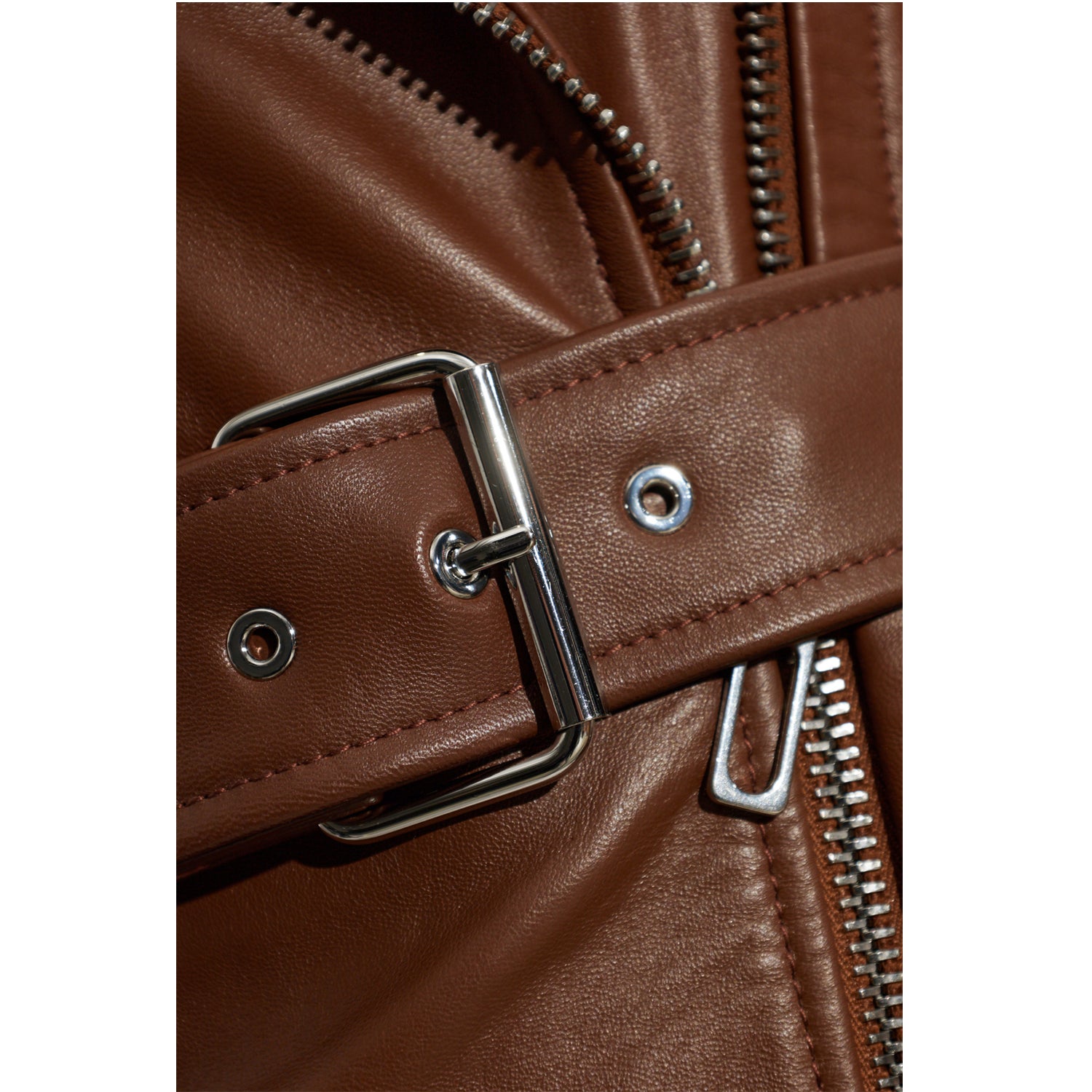 Women’s chocolate-brown leather mini dress showing asymmetric biker zipper and wide notched lapels