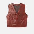 Women’s reddish-brown cropped leather vest front view with flap chest pockets and snap-style closure