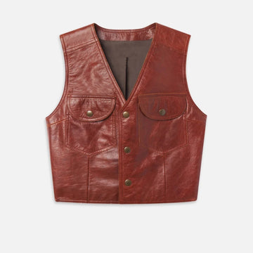 Women’s reddish-brown cropped leather vest front view with flap chest pockets and snap-style closure