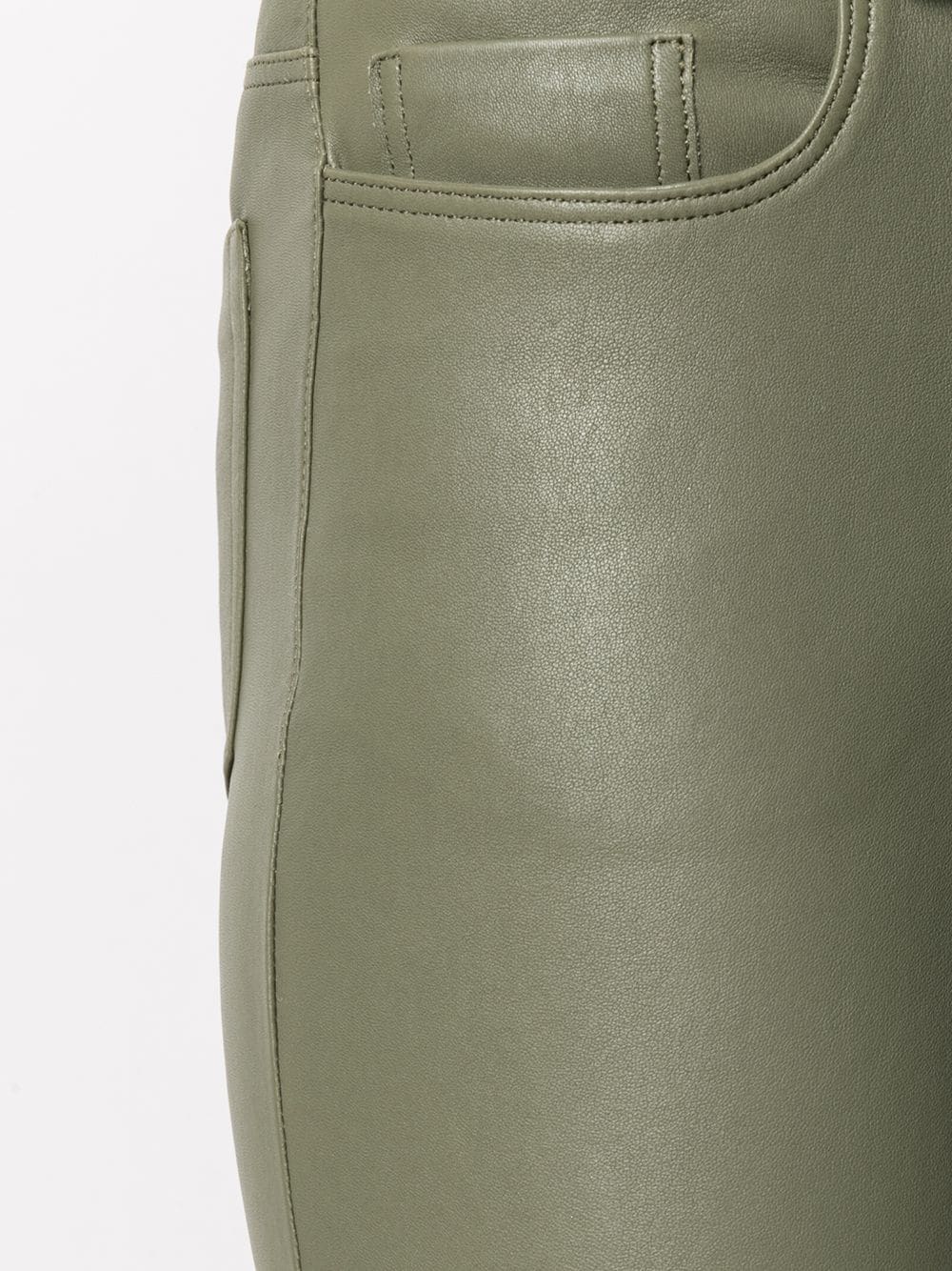 Close-up of lambskin texture on Women's Olive Green Leather Pants for premium quality detail.