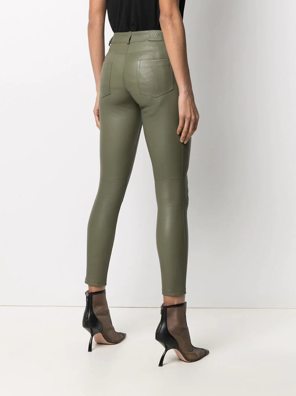 Front view of Women's Olive Green Leather Pants - Slim Fit Lambskin with button closure and sleek finish.