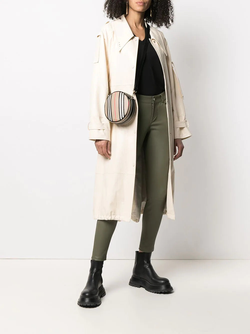 Model styled in Women's Olive Green Leather Pants - Slim Fit Lambskin with boots and oversized blazer.