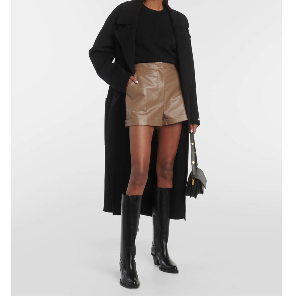 Front view of women’s high-waisted brown leather shorts with a chic, tailored fit.