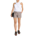 Front view of women’s real leather taupe shorts with a high-rise designer fit, styled with a neutral top.