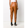 Back view showcasing Women's Tan Pleated Leather Pants - High Waist Tapered Fit.